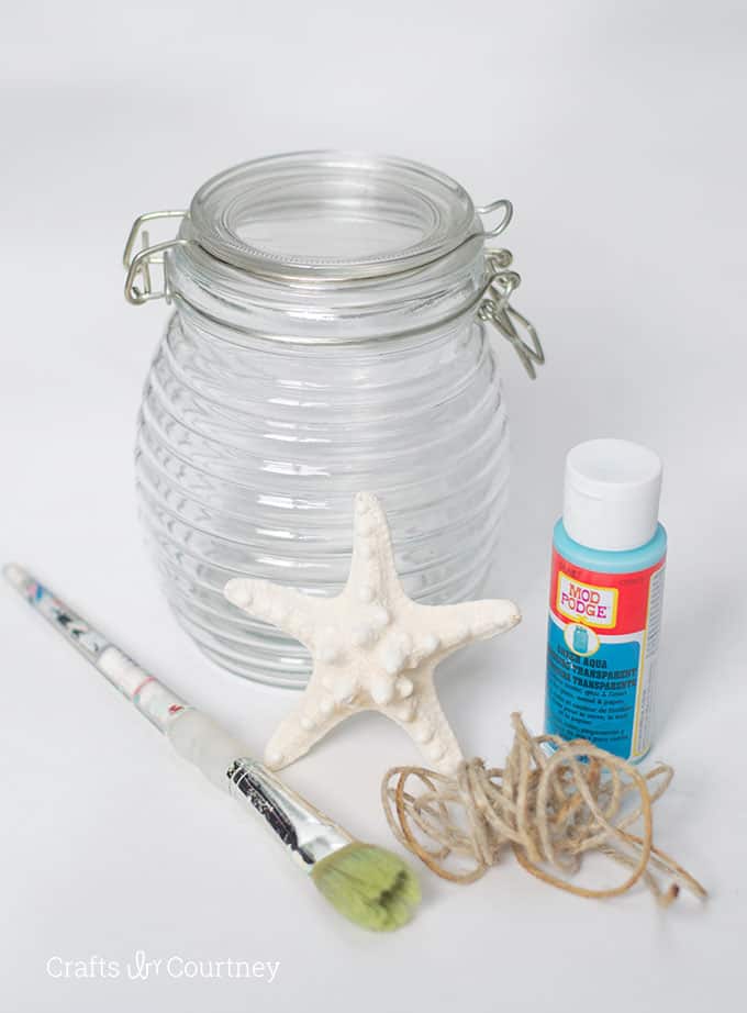 Glass jar, Mod Podge, paintbrush, twine, and a starfish