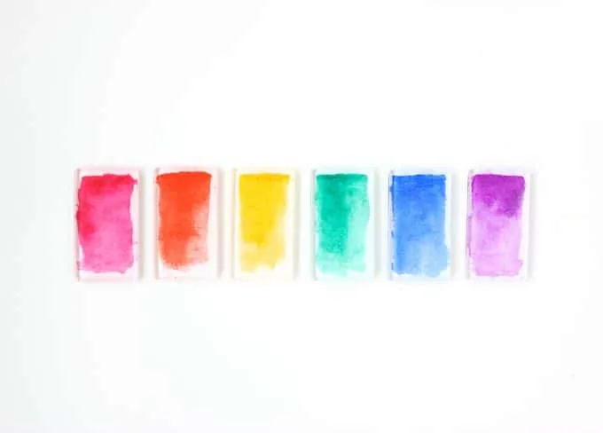Make these cool watercolor DIY magnets using Podgeable shapes and Paper Mod Podge. They look great in a rainbow palette!
