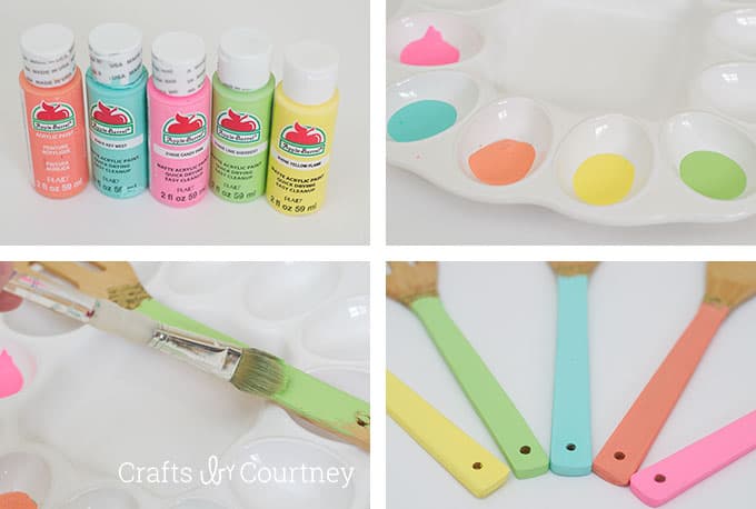 Painting colorful acrylic paint on the handles of the spoons