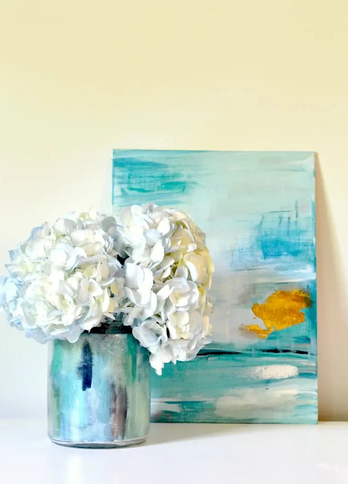 Bring in spring with a beautiful DIY vase you can make with Mod Podge and painted watercolor paper. No skillset required!
