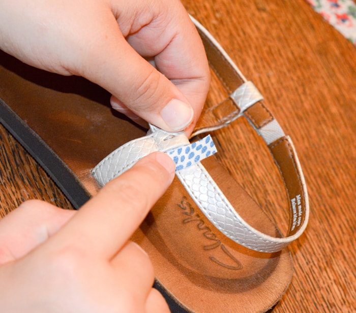 Wrapping fabric strips around the sandal strap