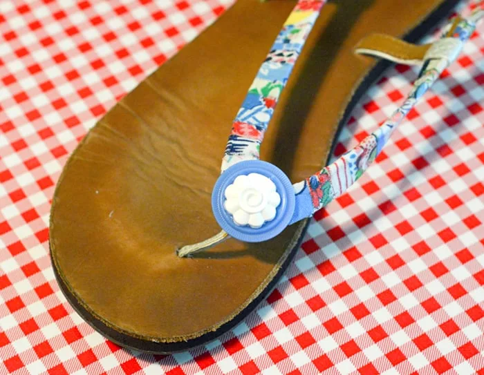 Embellishment glued to the front of the sandal strap