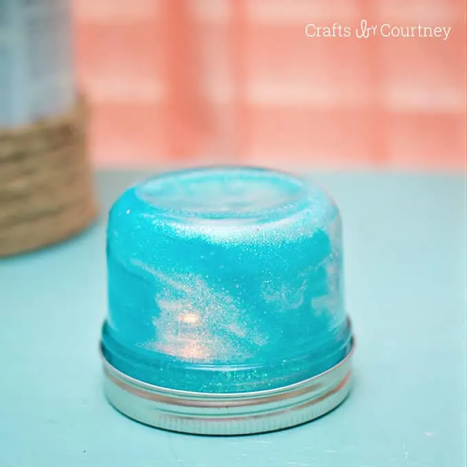 This DIY mason jar night light can be made on a budget - and your kids can help. The glitter is so sparkly and fun for night time!