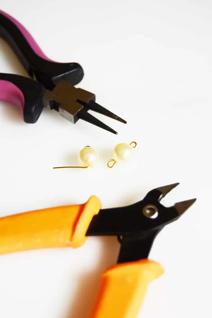 Jewelry tools with a pearl bead and gold findings