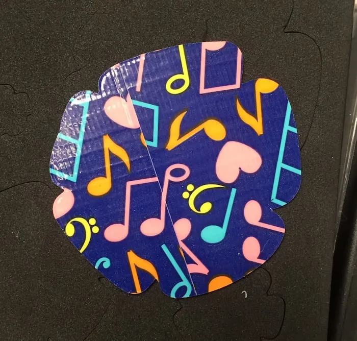 Floral charm punched out of musical note Duck Tape