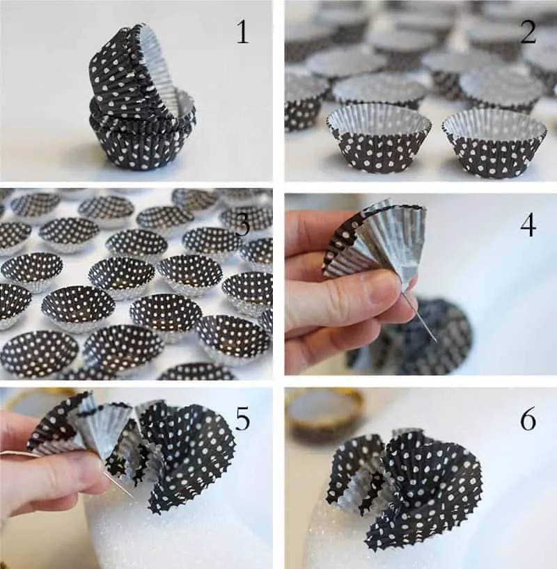 Attaching cupcake liners to a wreath form using pins