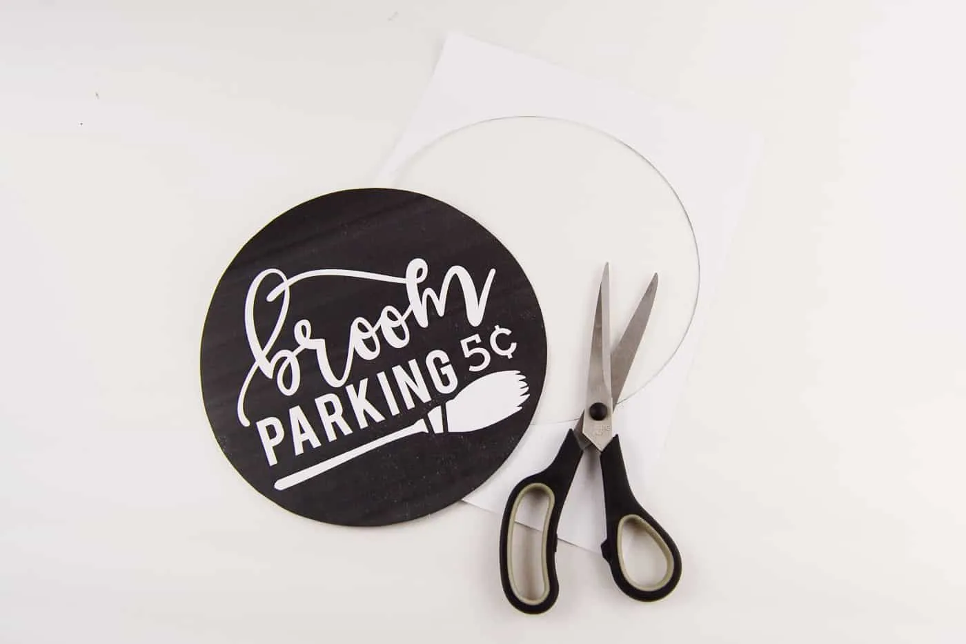 Broom parking printable cut out with a pair of scissors