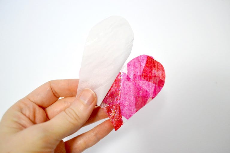 Peeling the parchment paper off the back of the tissue paper heart