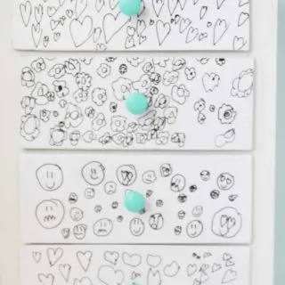 Child's drawings on the front of dresser drawers