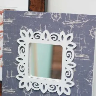 IKEA Wall mirror decoupaged with scrapbook paper