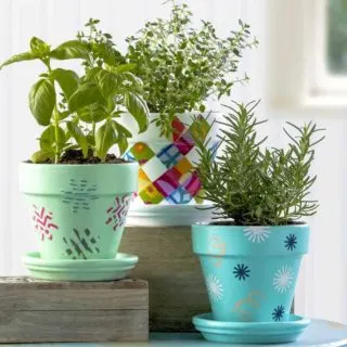 Flower pot decoration using fabric, stencils, and washi tape