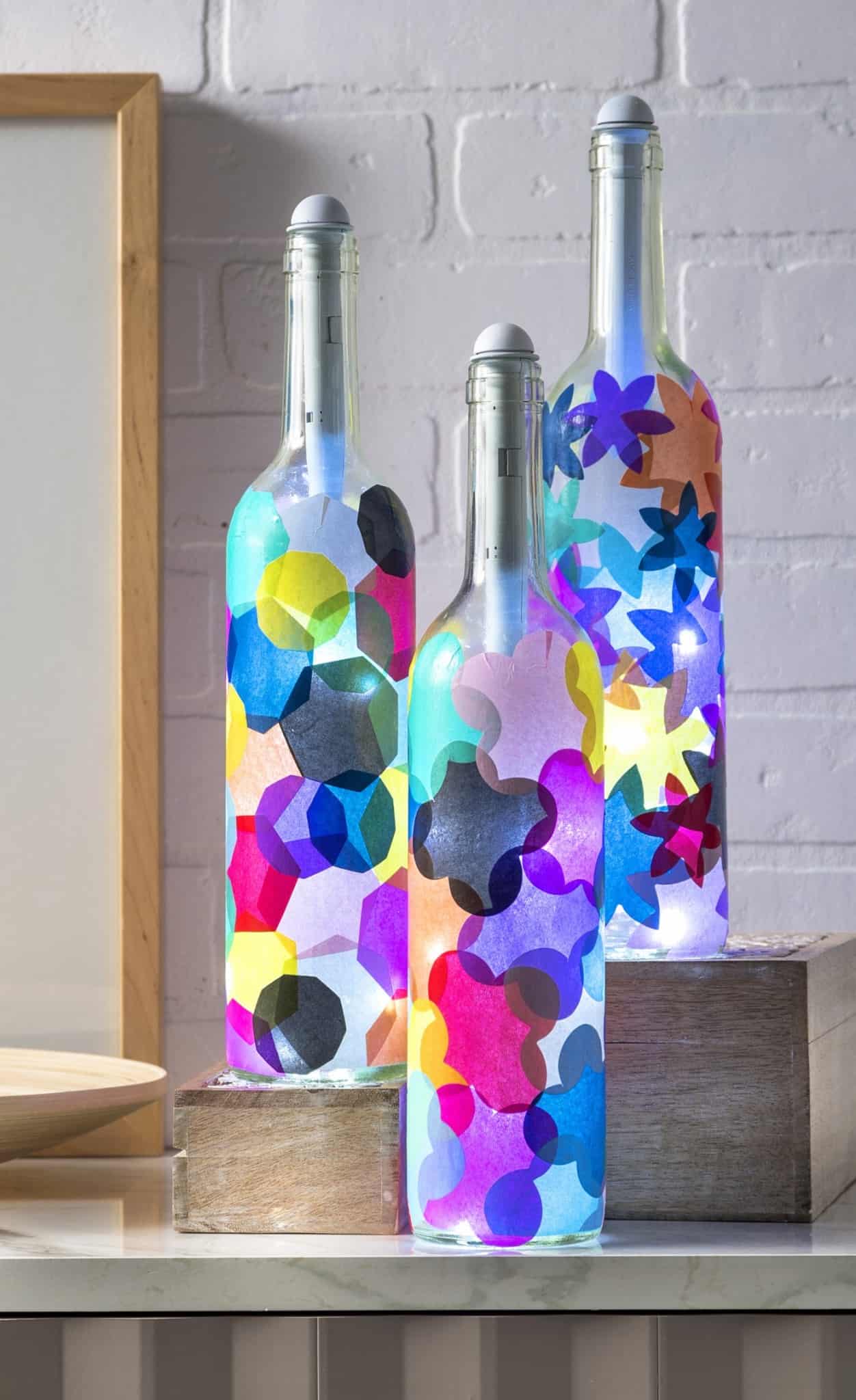 If you love wine bottle crafts, these lanterns are easy to make with tissue paper and Mod Podge. The bottle lights are easy to install and make the project!