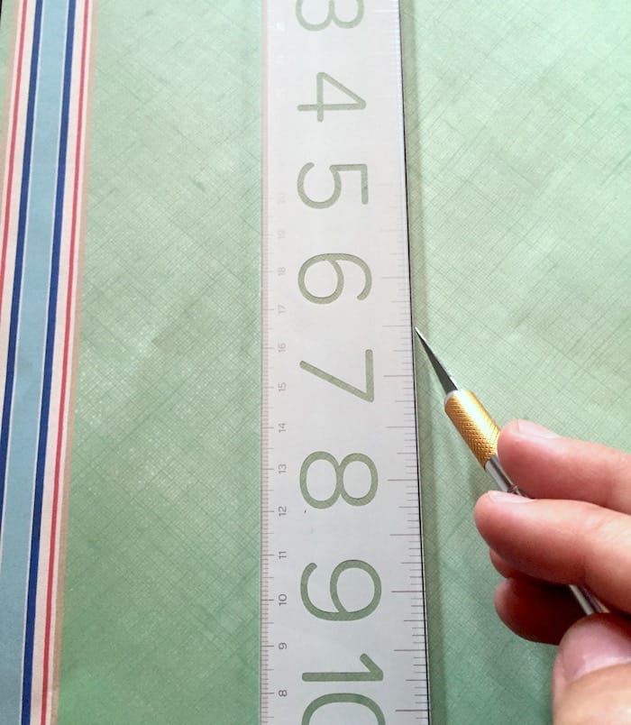 Trimming paper using a ruler and craft knife