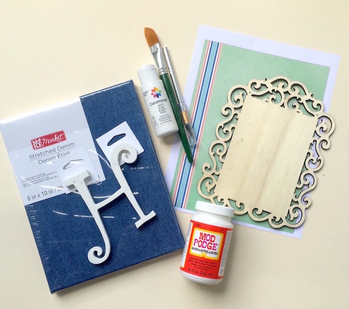 Denim canvas, wood shape, striped paper, wood letter, white paint, and Mod Podge Gloss