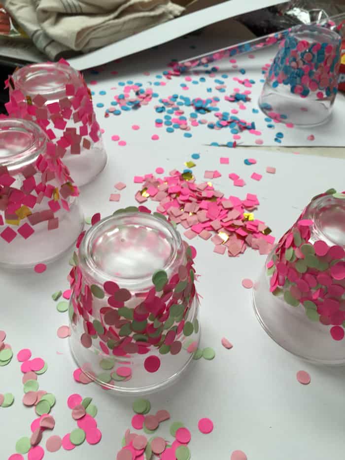 Sprinkled confetti on glass candle holders