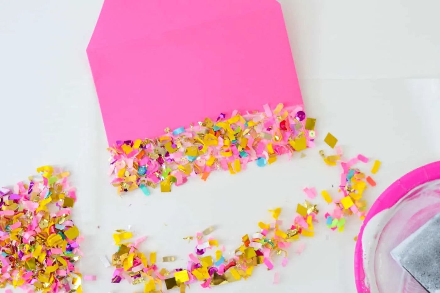 Excess confetti shaken off the envelope