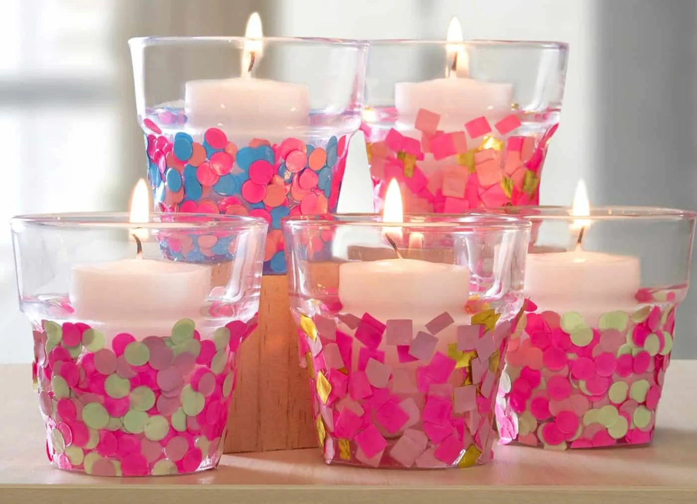 Decorate candle holders with confetti and Mod Podge