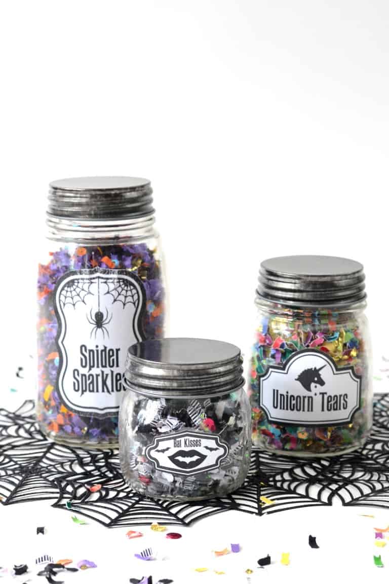 Confetti jars that glow in the dark make a perfect party favor for a Halloween celebration. Because who doesn't love confetti?! Get a free printable too!