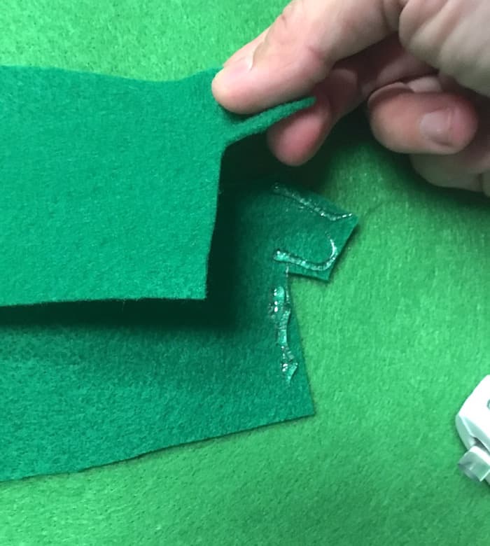 Hot gluing two pieces of felt together to make a shirt