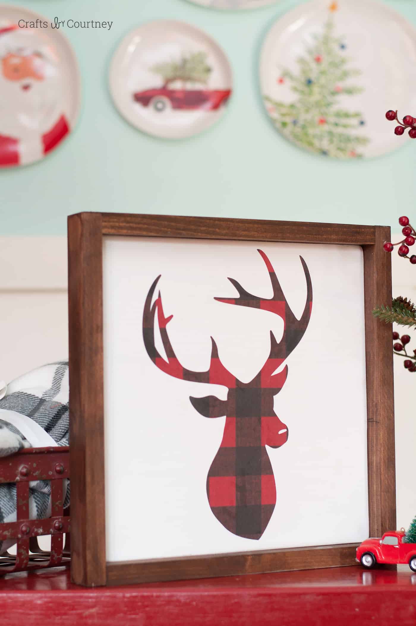 Handmade DIY Christmas sign featuring a buffalo plaid deer