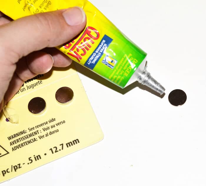 Adding glue to the back of a magnet