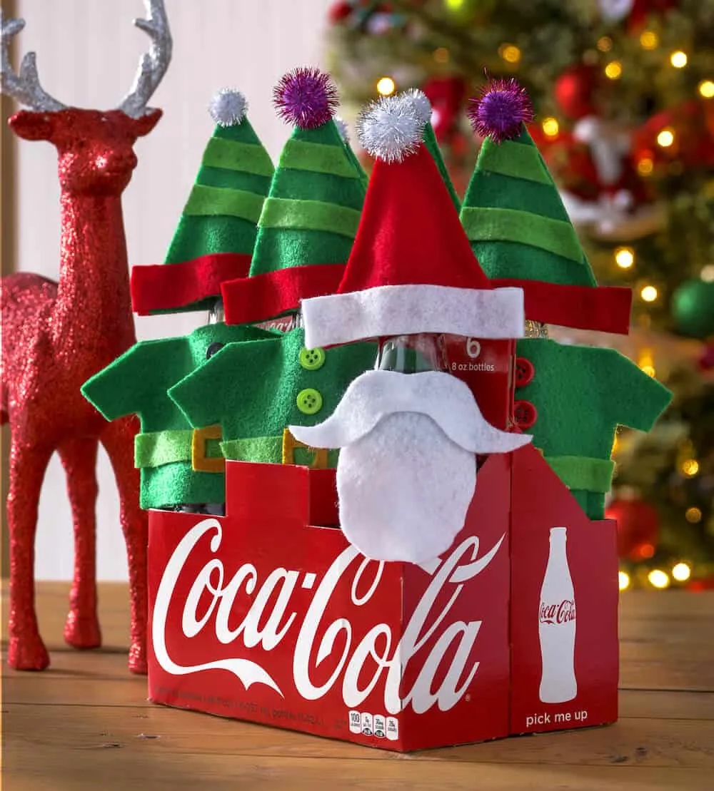 Christmas Coke bottles in Santa and elf attire