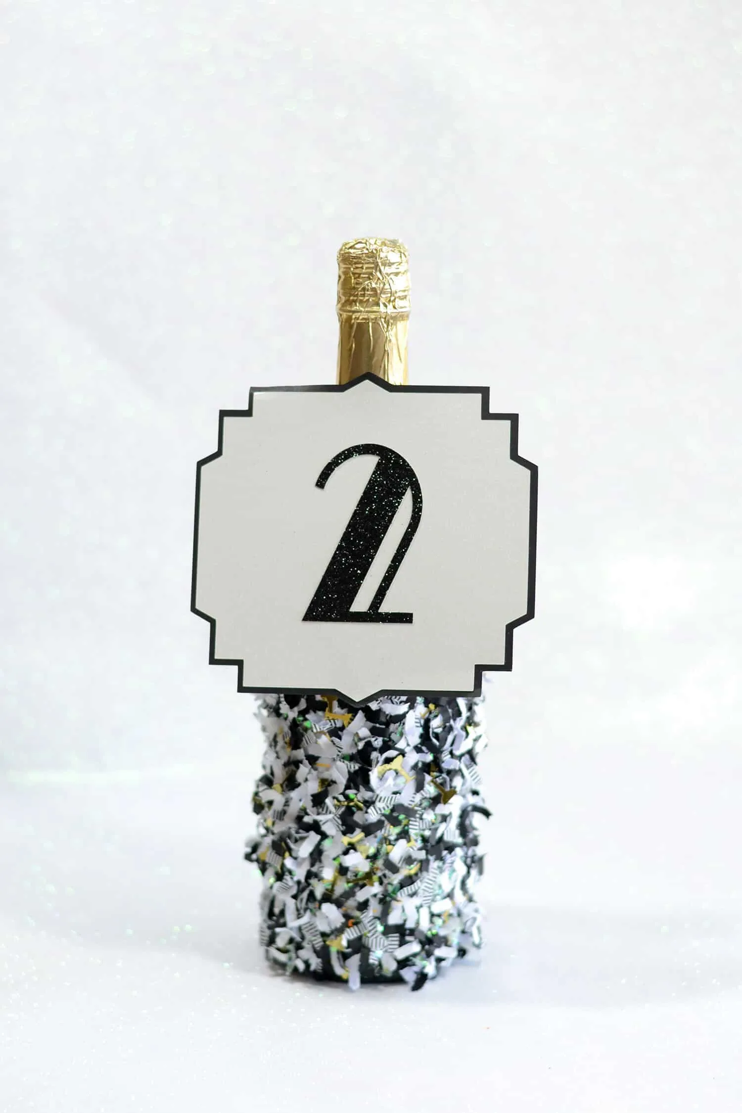 Wedding number champagne bottle with confetti