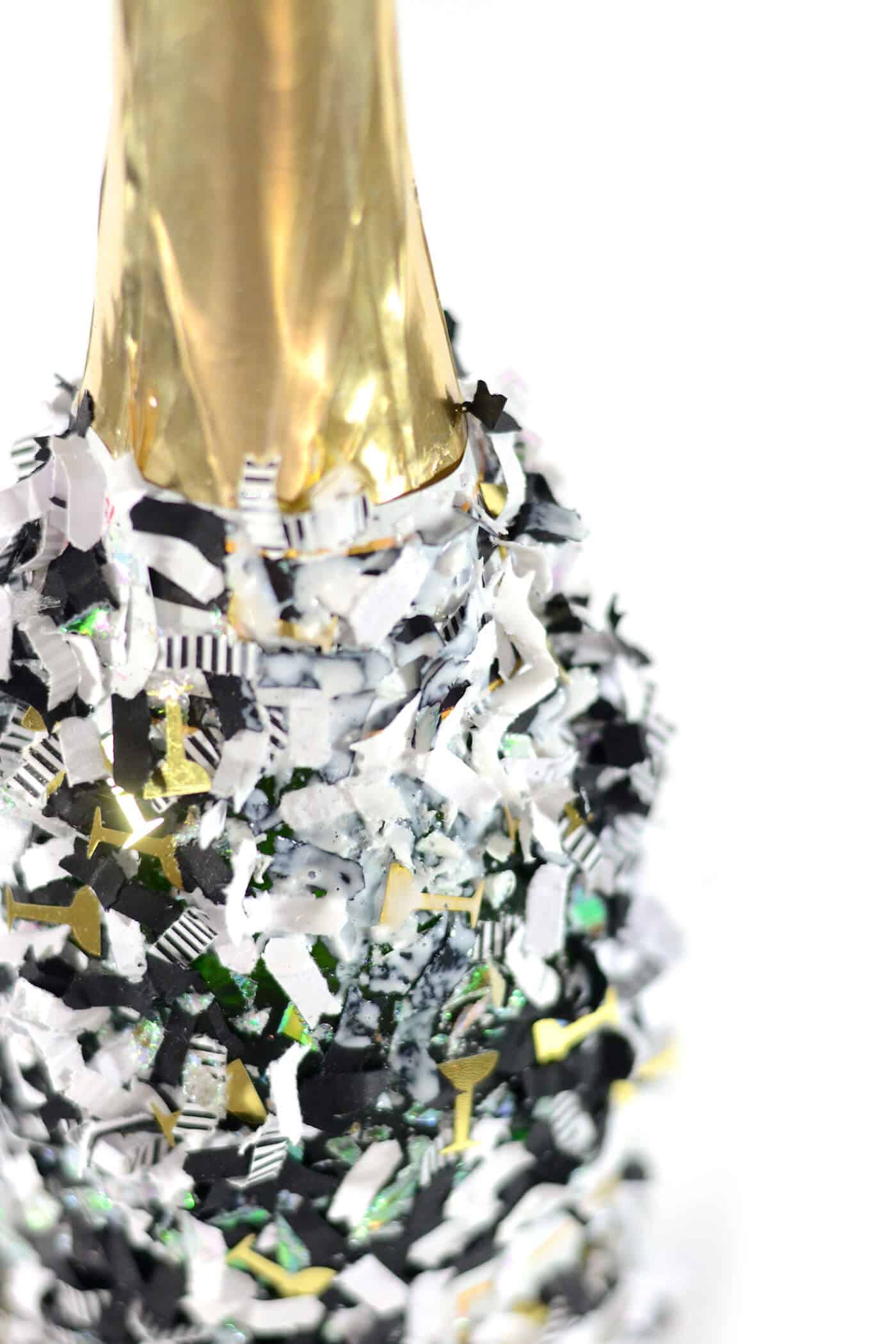 Confetti sprinkled on a champagne bottle
