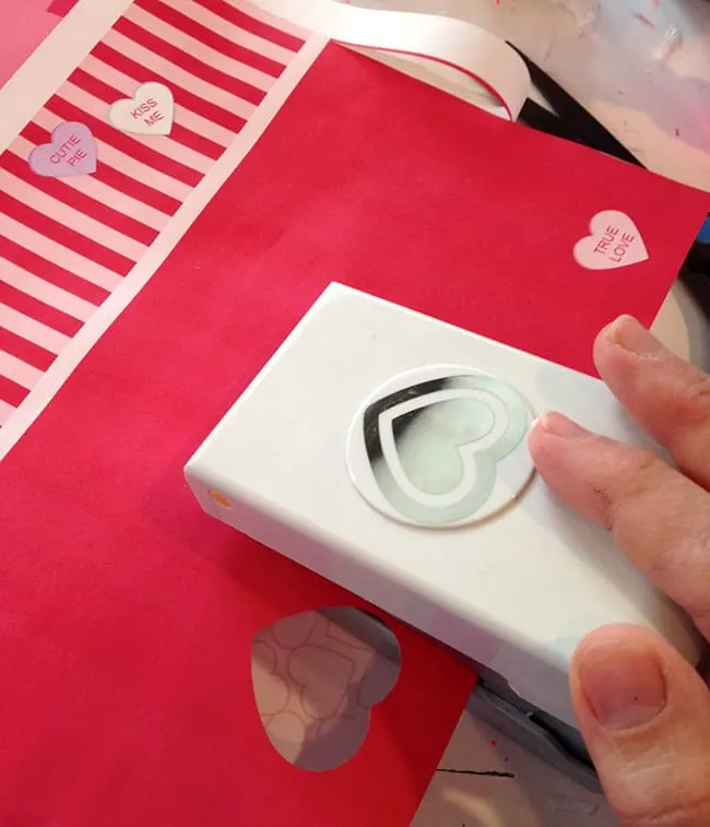 Using a paper punch on scrapbook paper