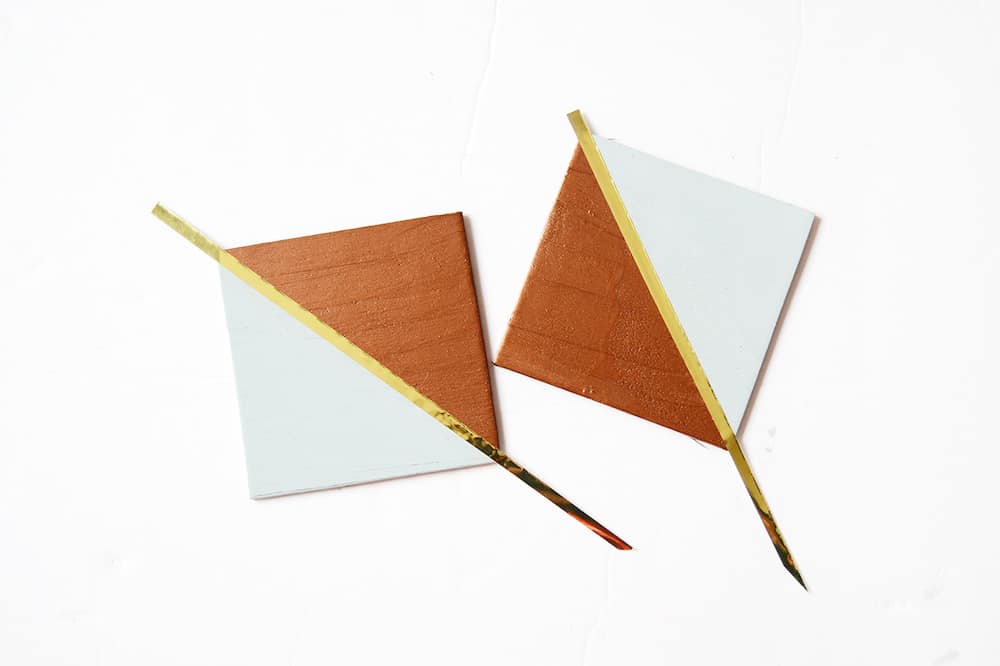 These trendy copper and gold DIY coasters are so easy to make using wood squares! Perfect for entertaining or giving as gifts.