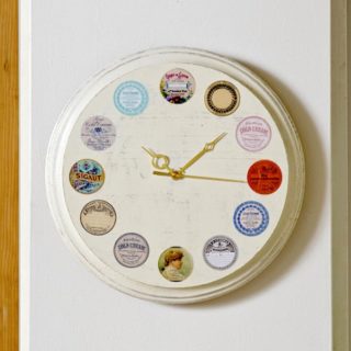 This DIY wall clock is easy to make, using vintage inspired labels and Mod Podge. Follow this tutorial and create your own version!