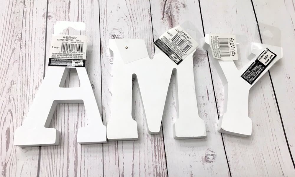 White wood letters spelling AMY