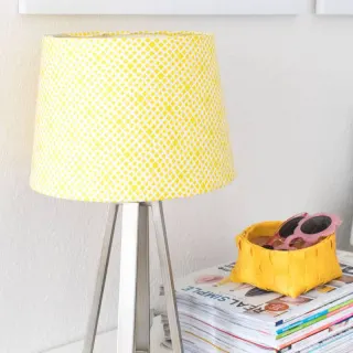 This lampshade makeover project takes less than 30 minutes and it’s incredibly easy to do! Use your favorite fabric along with Mod Podge.