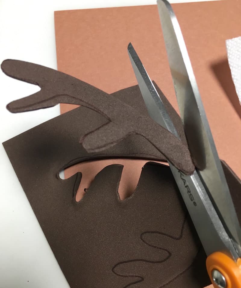 Cutting antlers out of craft foam using scissors