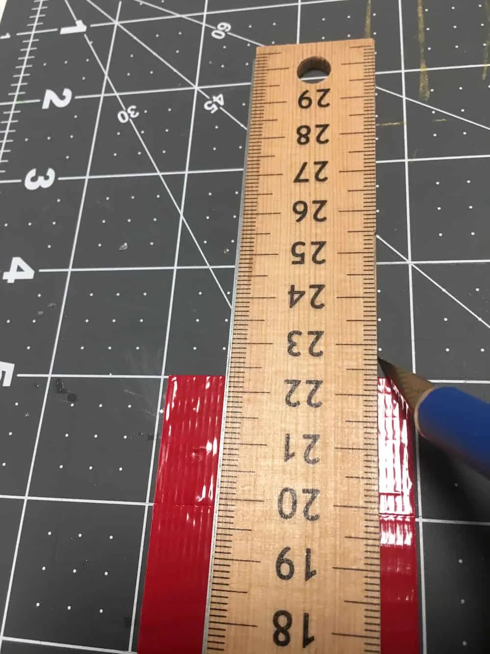 Cutting Duck Tape strips with a craft knife and ruler