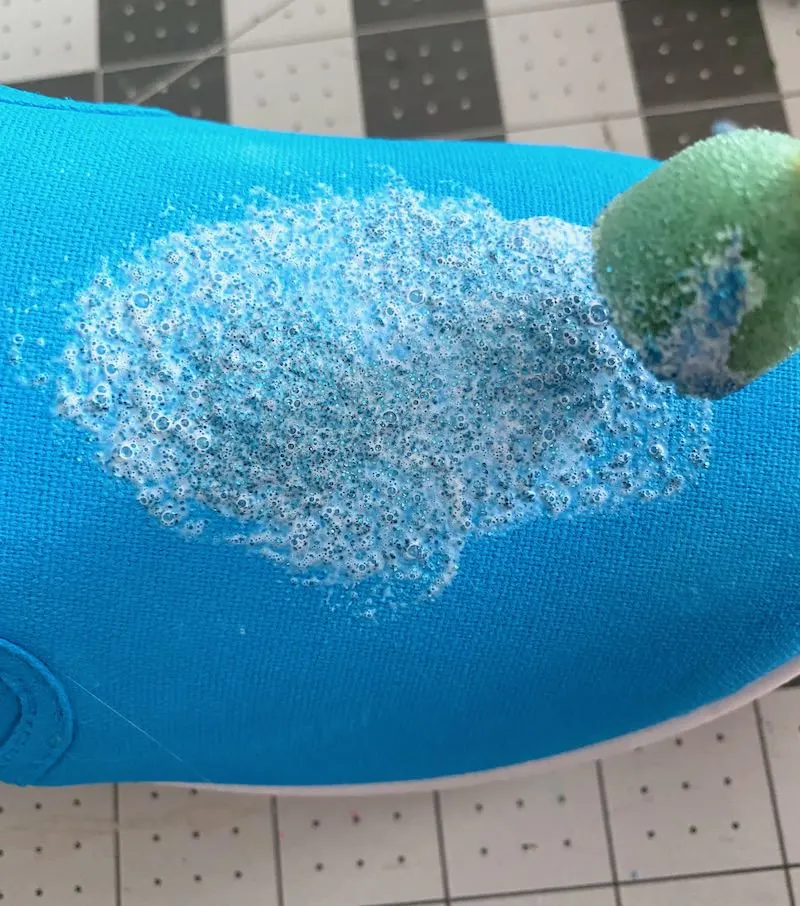 Applying glitter to shoes with a spouncer