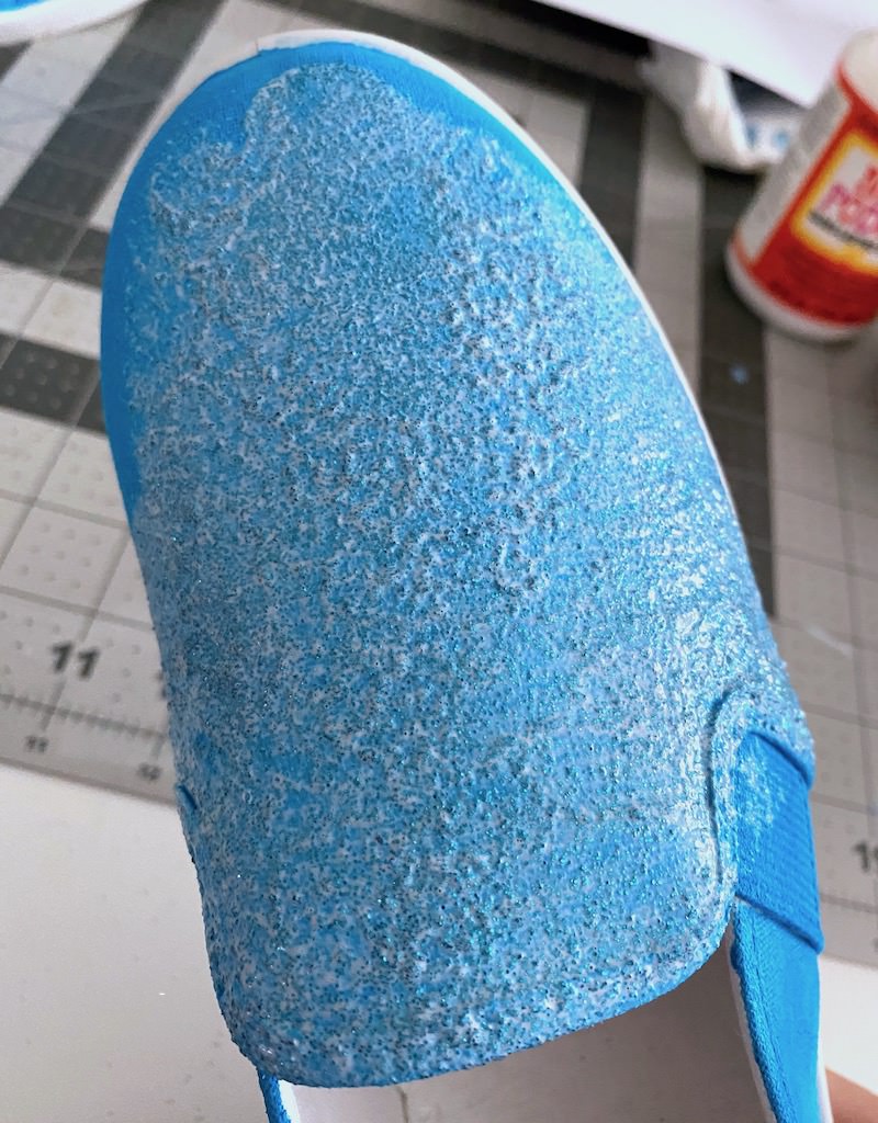 Front of a a shoe covered in glitter and Mod Podge