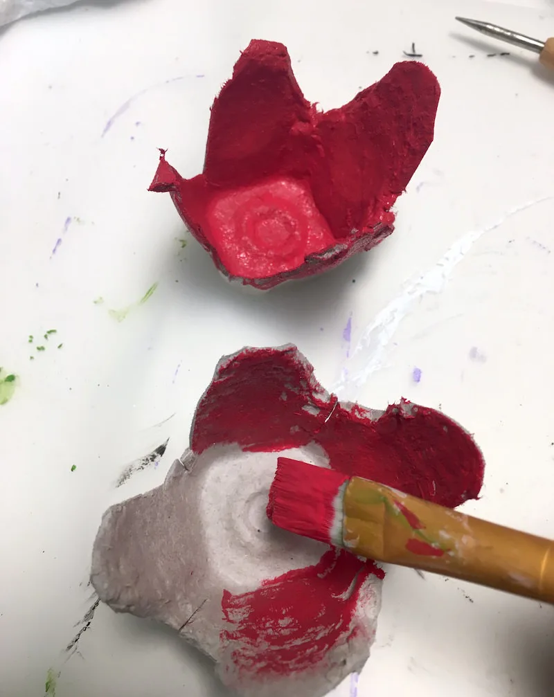 Paint egg carton flowers with red acrylic paint