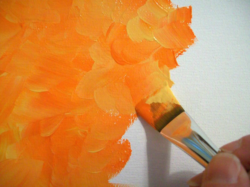 Double loaded brush with orange and yellow