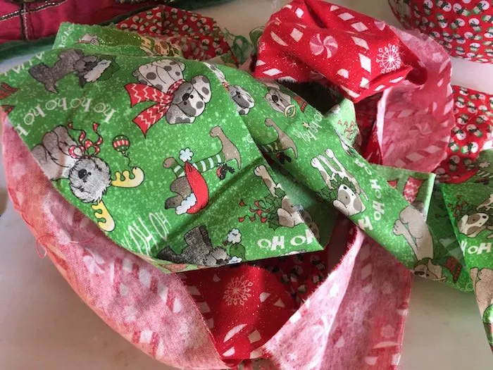 Christmas fabric scraps in a pile
