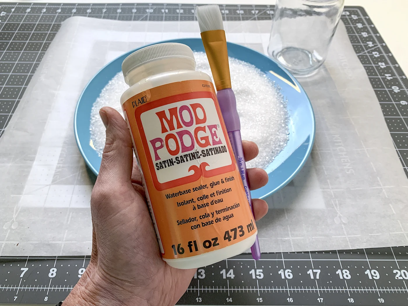 Bottle of Mod Podge Satin and a plate of epsom salt