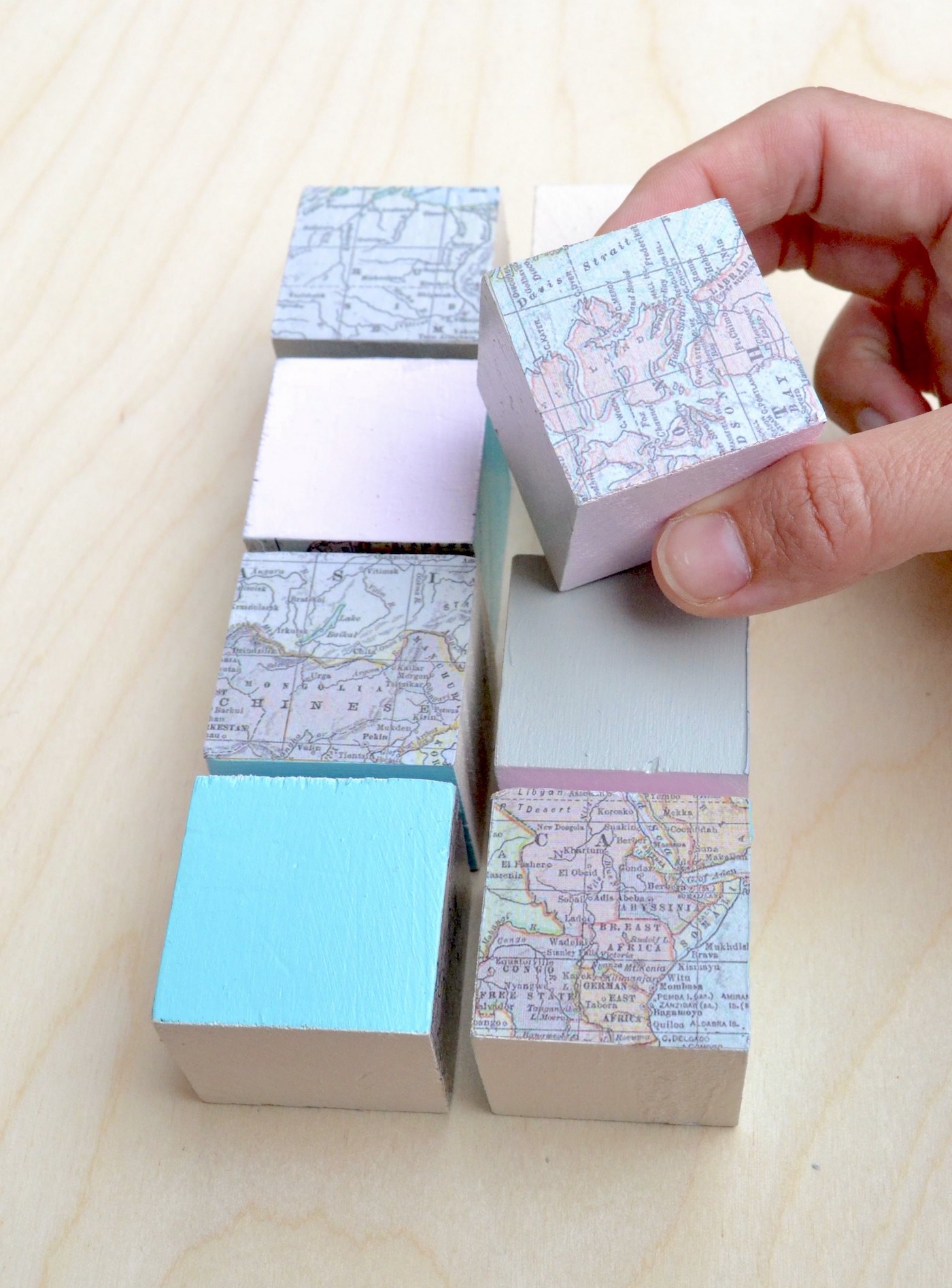 Decorate wooden blocks with maps