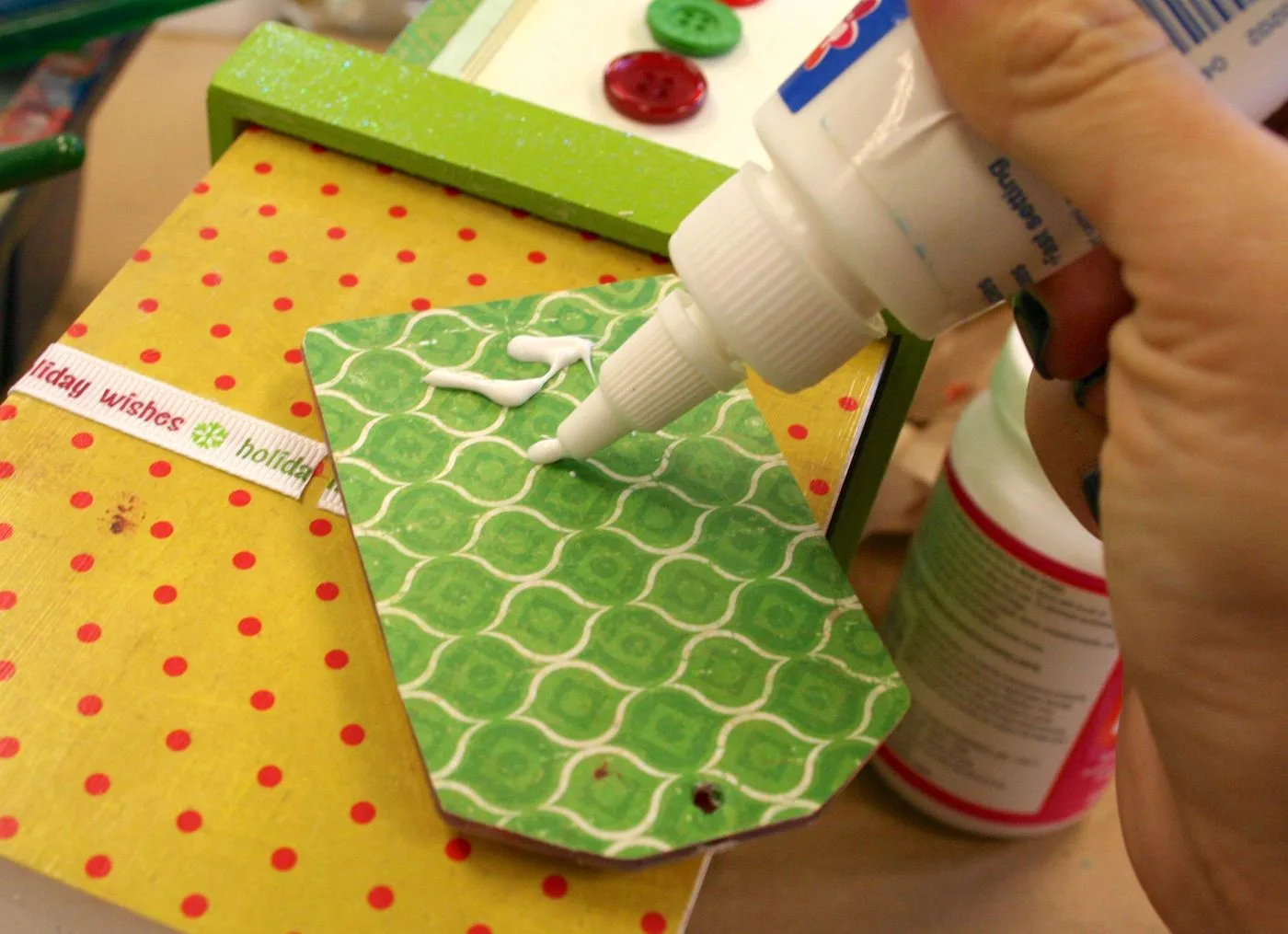 Gluing the gift tag down to the wood box with craft glue