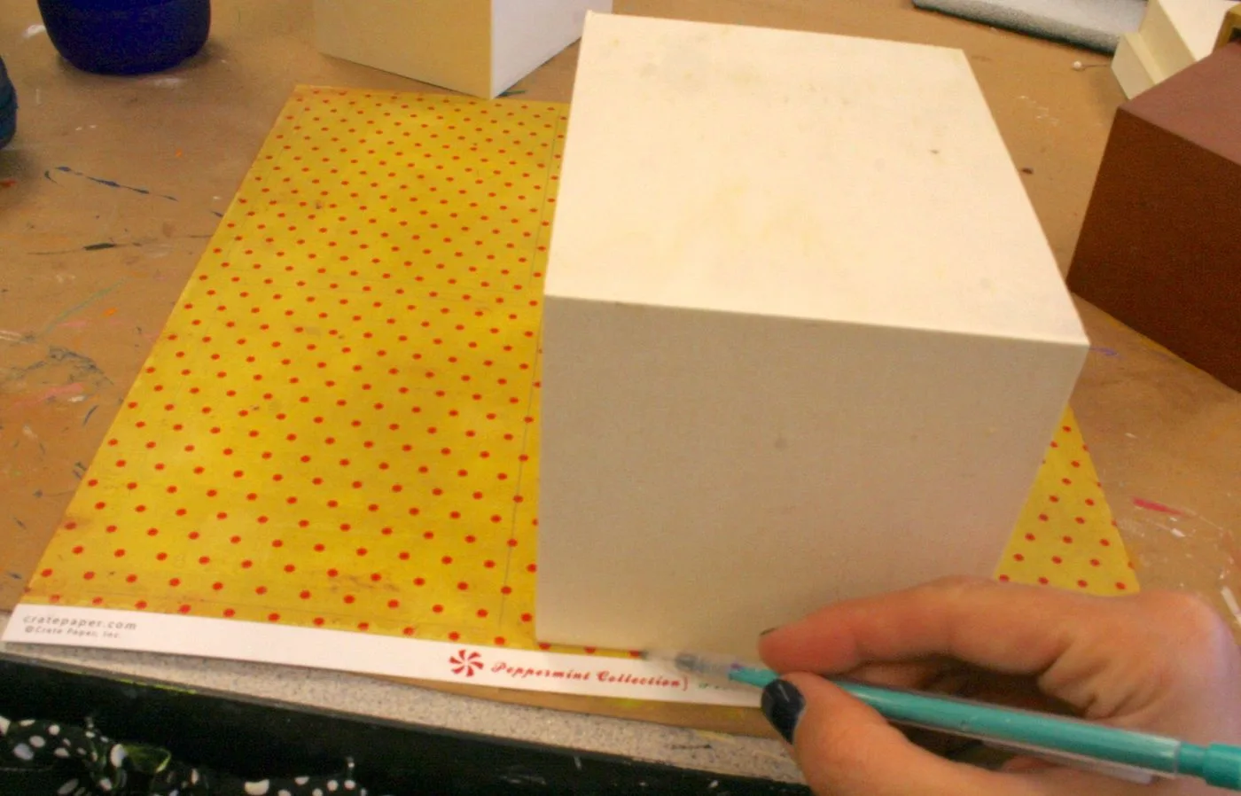 Tracing a wood box onto scrapbook paper