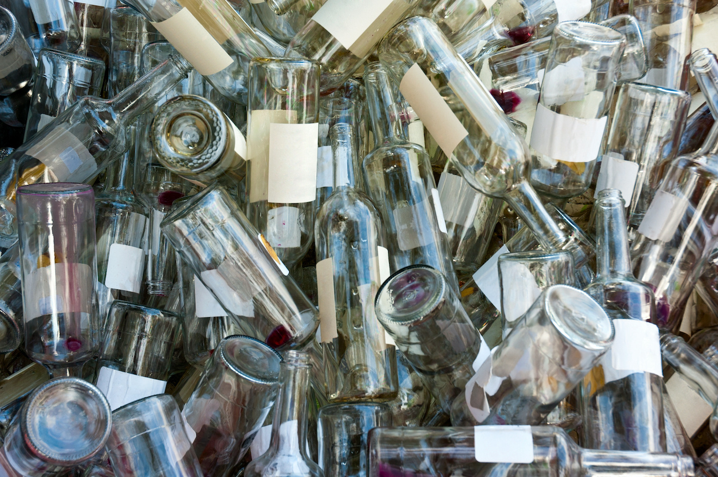 Glass-bottles-with-labels-in-a-pile