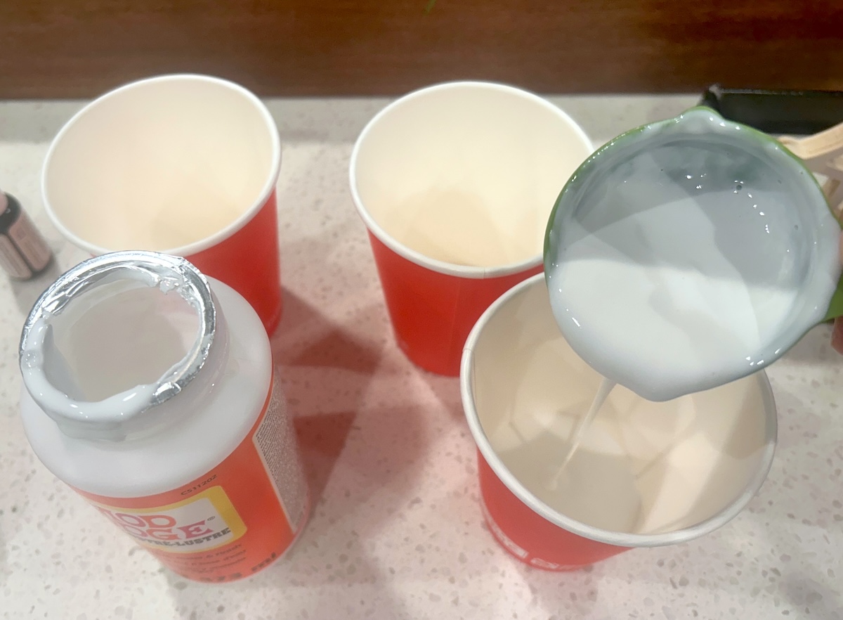 adding Mod Podge to cups