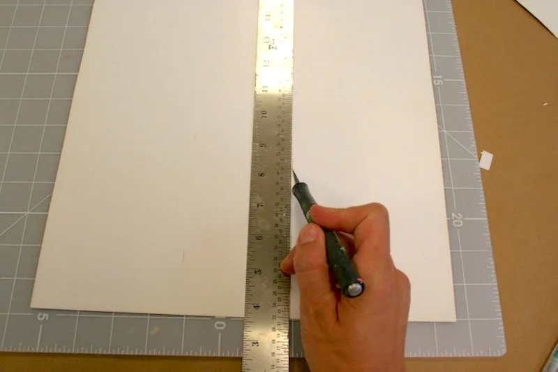 Measuring and cutting paper with an X-Acto knife