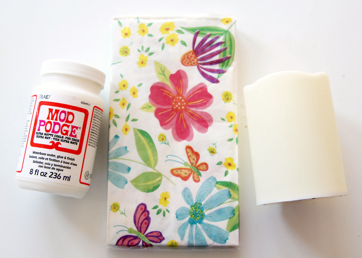 Mod Podge bottle, floral napkins, and a flameless candle