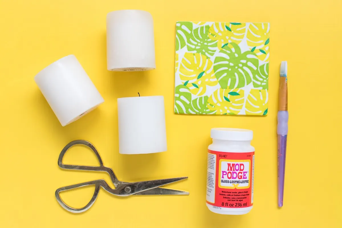 Napkins, Mod Podge, candles, scissors, and a paintbrush