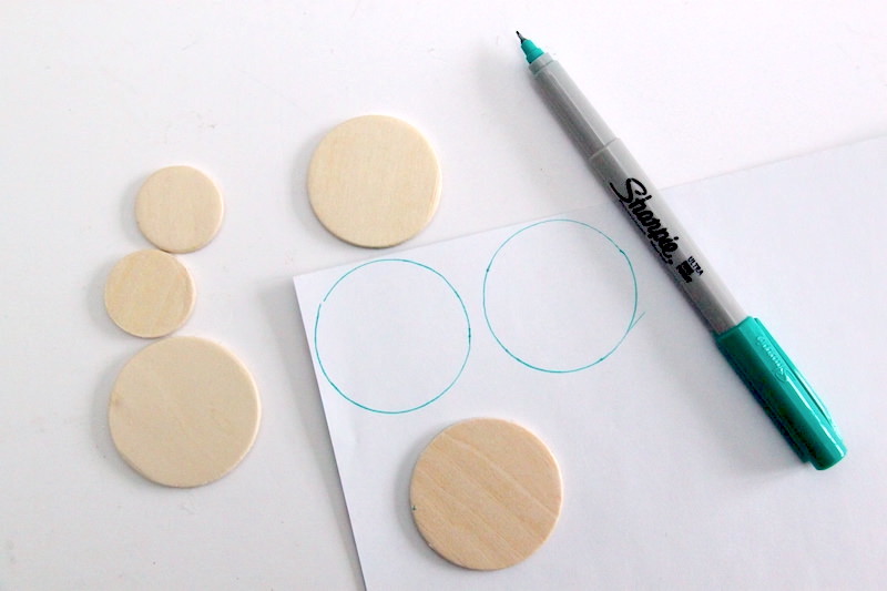 Tracing circles onto the back of a piece of scrapbook paper